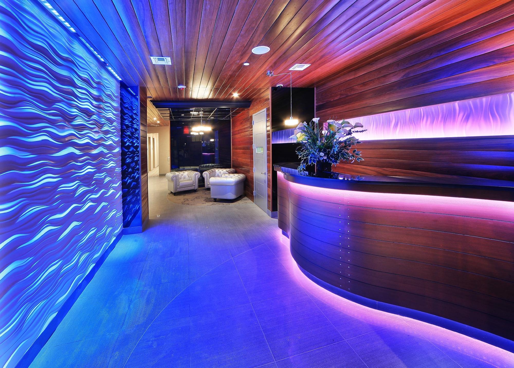The Aura Hotel modern lobby with vibrant lighting